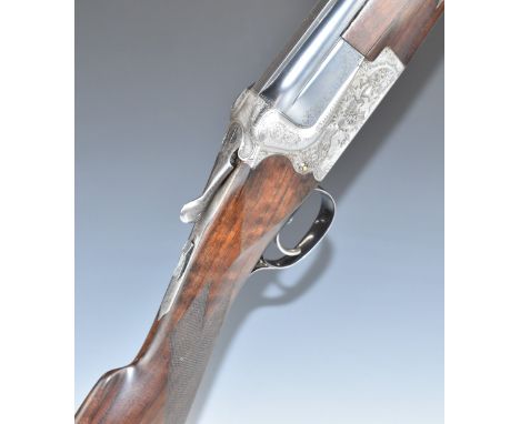 Merkel 201E 12 bore over and under ejector shotgun with engraved scenes of foxes and birds to the locks, engraved top plate, 