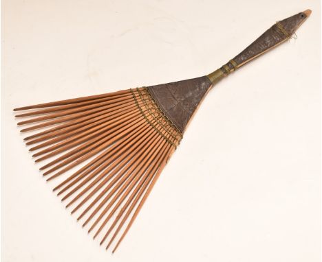 Polynesian carved wooden and wirework comb, 25.5cm long.&nbsp;