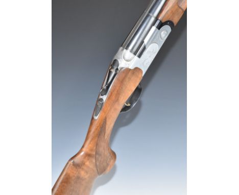 Beretta Model S687 12 bore over and under shotgun with engraved scenes of birds to the locks and underside, engraved trigger 