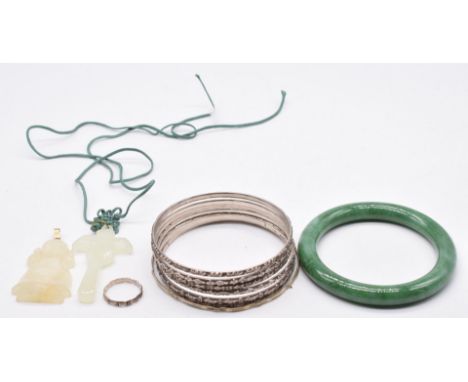 Six Hong Kong silver bangles, a jadeite bangle, hardstone pendants, etc&nbsp;
