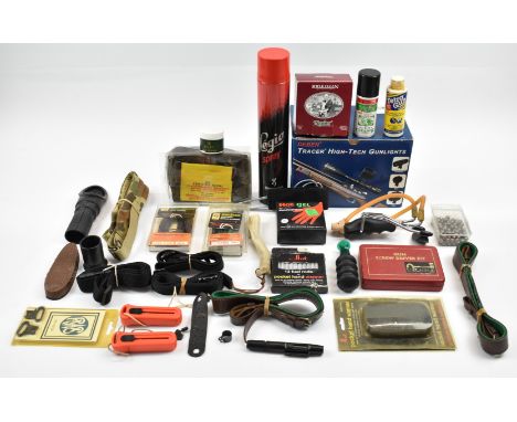 A collection of gun and shooting accessories including Deben Tracer Mini gun light, cleaning kit, game carrier, animal calls,
