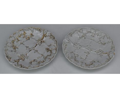 Two Meissen relief moulded cabinet plates with gilt decoration, diameter 21.5cm