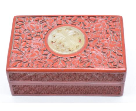 Chinese cinnabar lacquer lidded box set with a carved jade or hardstone roundel, W10 x D65 x H4cm