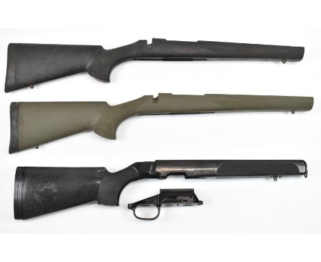 Three composite bolt-action rifle stocks comprising two Howa and one SSG, all with sling mounts.&nbsp;