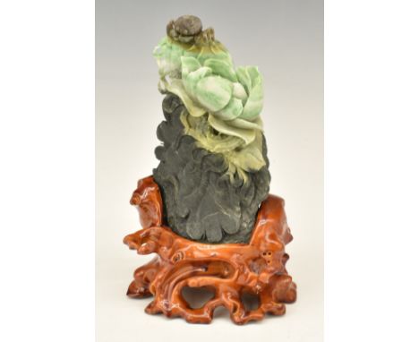 Chinese carved jade boulder with crab and flower decoration, on wooden stand, 22cm tall.&nbsp;