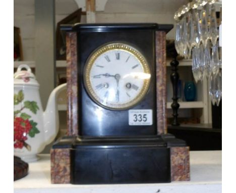A black slate mantel clock