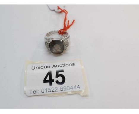 A 9ct white gold ring set smoky quartz and pave' diamonds, size K