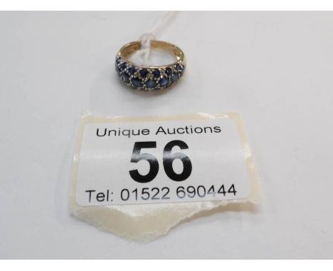 A 9ct gold ring set sapphires, size K