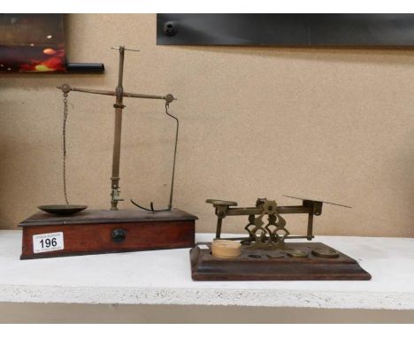 A Set of Victorian brass postal scales and a set of Victorian brass apothecary scales, both with weights