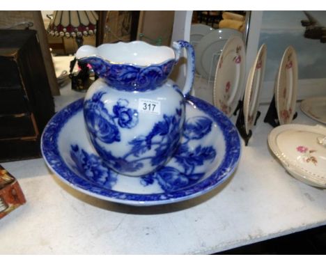 A blue and white jug and basin set