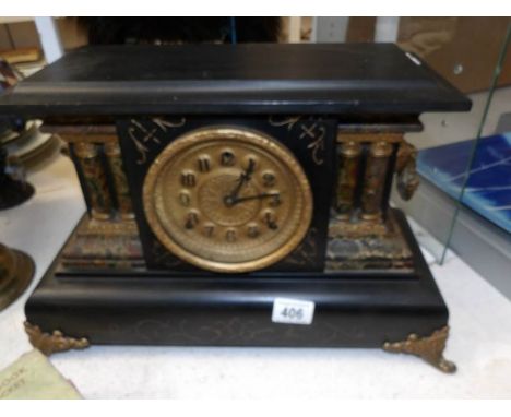 A black painted paladian style mantel clock