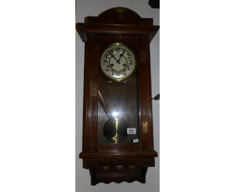 A 1930's oak wall clock