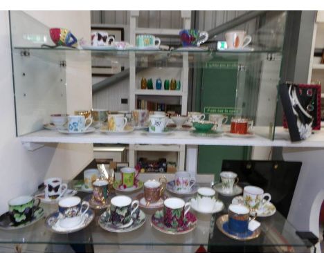 A large collection of tea cups and saucers including Wedgwood, Limoges etc