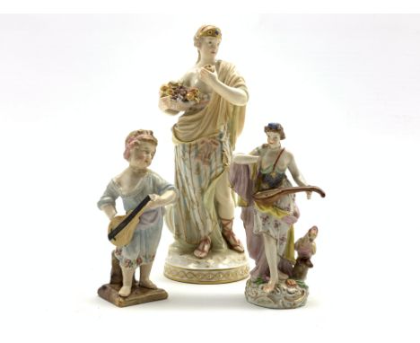Berlin KPM standing female figure holding a basket of fruit and inscribed 'Geschmack' H17cm, a small Continental figure with 