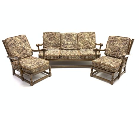 Ercol old colonial Yorkshire elm three piece lounge suit, comprising two easy armchairs, (W70cm) and a three seat sofa, (W171