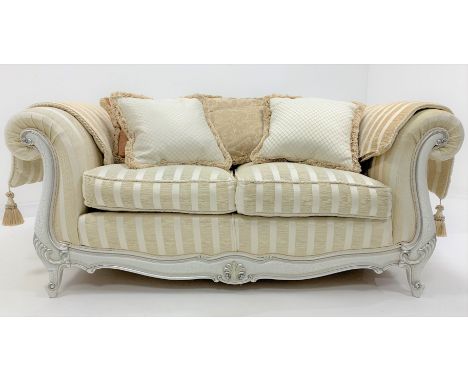 French style two seat sofa, arched back, scrolled arms, squab cushions, shell carved shaped and moulded apron and scroll carv