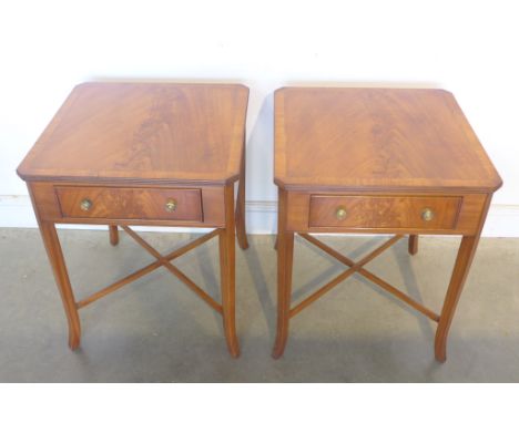 A pair of fruit wood veneered lamp tables, with a single drawer, on splayed legs, united by cross stretcher, made by a local 