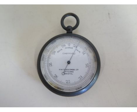 A base metal compensated pocket barometer, 5cm diameter 