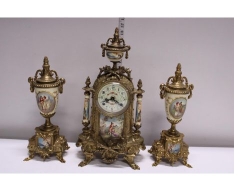 A gilt brass mantle clock with two garnitures, movement by Franz Hermle. Shipping unavailable