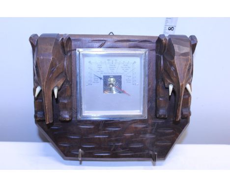 A wooden elephant formed barometer 