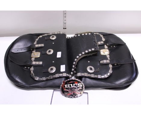 A leather motorbike set of panniers and a Elvis belt buckle 