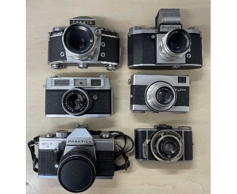 Six vintage cameras, to include: Exakta Varex IIb; Praktica FX 2; Werra; Mamiya-Sekor; Praktica MTL 3; F Deckel-Munchen Compa