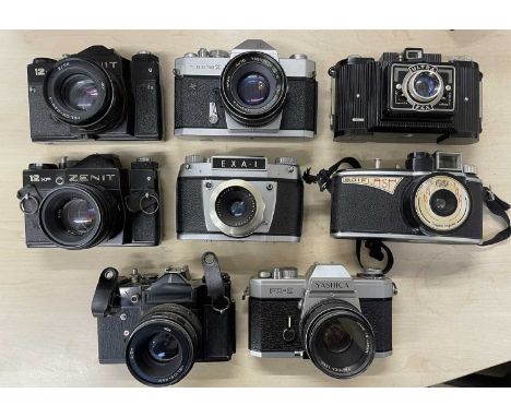 Eight vintage cameras, to include: Agilux AgiFlash; Yashica FX-2; EXA-I; Yashica TL Electo X;  Ultra Fex; Zenit; Zenit 12XP (