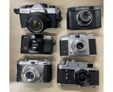 Six vintage cameras to include: Fujica STX-1; Cosmic 35; Halina Micro 35; Agfa; Zorki-4; Edixa