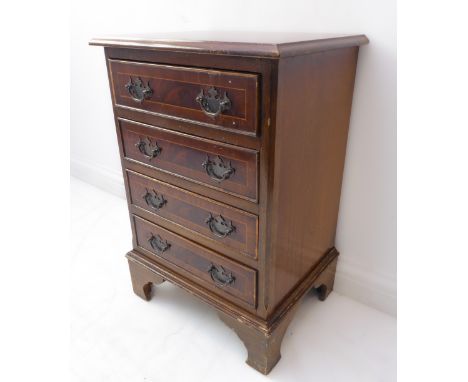 A Georgian style reproduction chest of small proportions: four full-width drawers and on high bracket feet (in need of re-pol