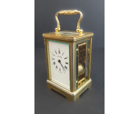 A fine 20th century (in 19th century style) gilt-metal and glass-sided carriage clock: the white-enamel dial with Roman numer