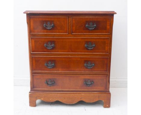 A reproduction Georgian-style mahogany chest: flame-veneered, crossbanded, moulded top above two half-width and three full-wi