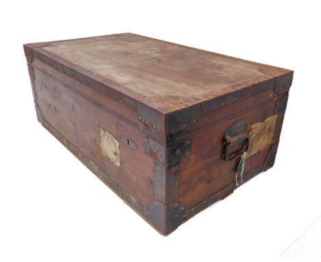 An early 20th century metal bound travelling trunk by Burne (British manufacturer): hinged lid with initials K.P., two locks 