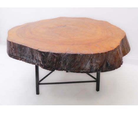 An unusual occasional table formed from a section cut from a mature tree trunk: good colour and patination, on later triform 