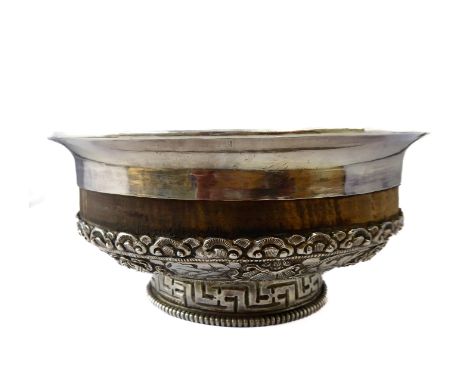 A Chinese silver export ware bowl of hardwood mounted with silver decorated with eight Chinese symbols of good fortune, scrol
