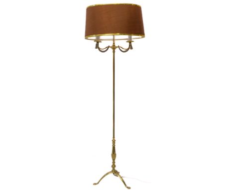 A brass lamp-standard with oval brown shade: two lights with rope-effect decoration and on tripod base (150 cm high)