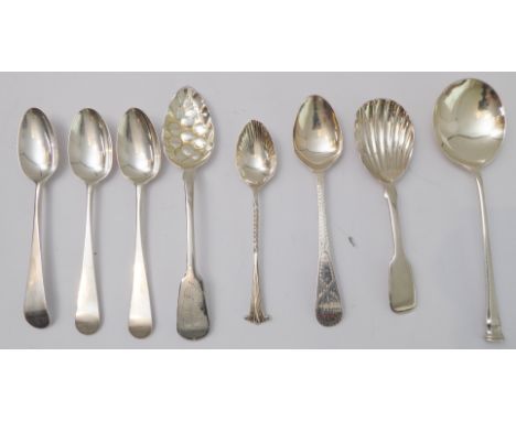 Four hallmarked silver teaspoons and four others to include a caddy spoon with shell-shaped bowl, a seal-topped spoon and a b