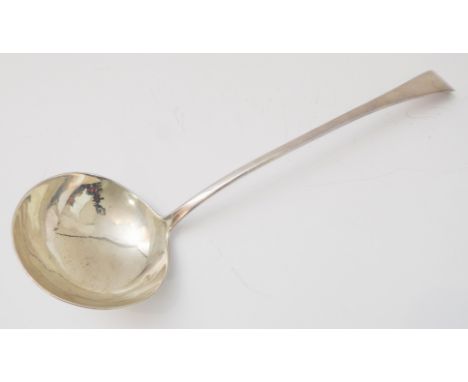 A George III period Old English pattern hallmarked silver soup ladle: engraved armorial crest; maker's mark TW; assayed Londo