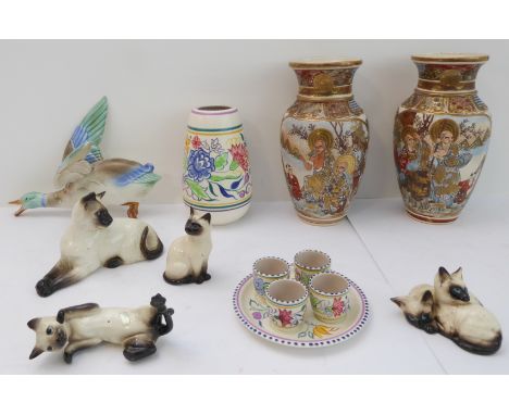 Ceramics comprising:a pair of Japanese Kyoto-style vases; a Poole Pottery vase;four egg cups on stand;four ceramic cats;a wal