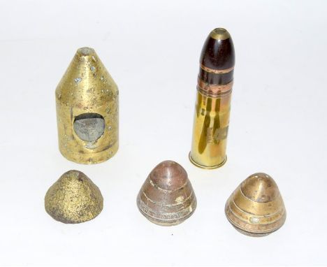 A complete inert WW1 German artillery shell 16cms x 4.5cms with two WW1 fuzes 6cms diameter a bronze extracror 13cms x 7cms a