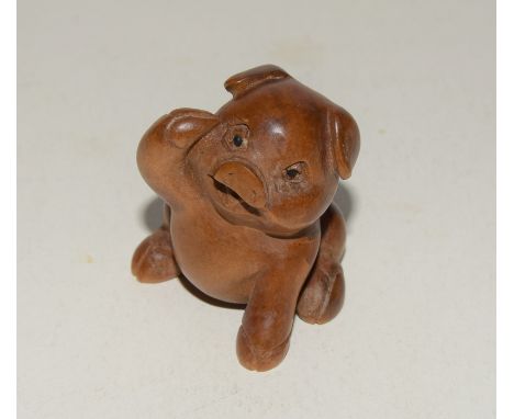 Japanese wooden netsuke in the form of a pig, signed to the base