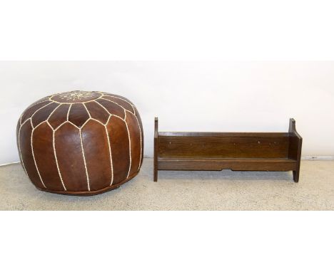 Leather pouffe and a wooden book trough