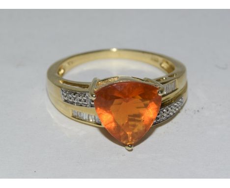 14ct yellow gold impressive trillion cut fire opal and diamond ring