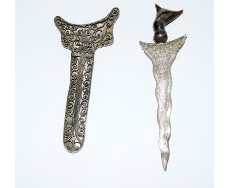 A miniature horn handled Kris in a silver filigree scabbard. Blade length 10cms