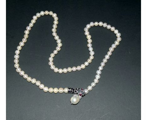 freshwater pearl necklace with a Baroque pearl clasp in the form of a snake inset with sapphires and ruby eyes