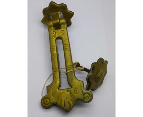 A brass door knocker/letter box 