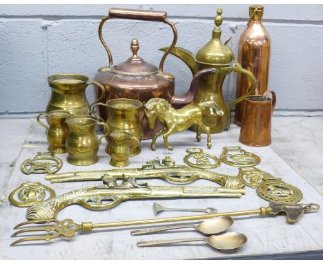 A box of metalware, including a copper kettle, a water flask, graduated mugs/tankards and a pair of brass pistol wall plaques