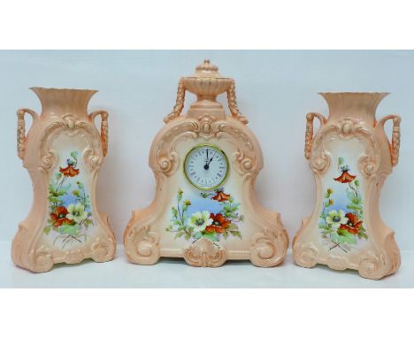 An Astral ceramic clock garniture 