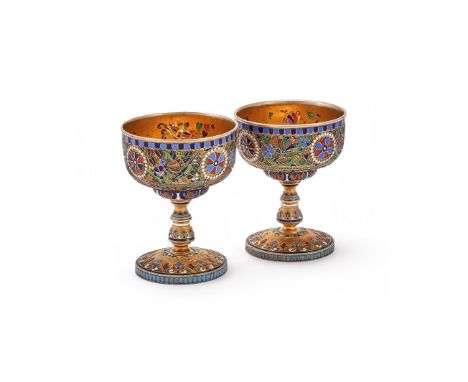 A PAIR OF RUSSIAN SILVER GILT CLOISONNE AND PLIQUE-À-JOUR ENAMELLED CUPS   The cups decorated with bright polychrome pique-à-
