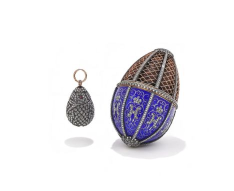 AN EARLY 20TH CENTURY DIAMOND AND ENAMEL EGG PENDANT AND CASE Designed as an egg, the top half of brown leather encased in go