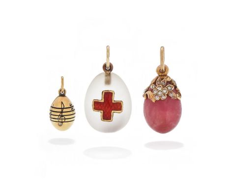 ALEXANDER TILLANDER, THREE EGG PENDANTS ST. PETERSBURG, CIRCA 1900 The first a frosted rock crystal egg, applied with a guill